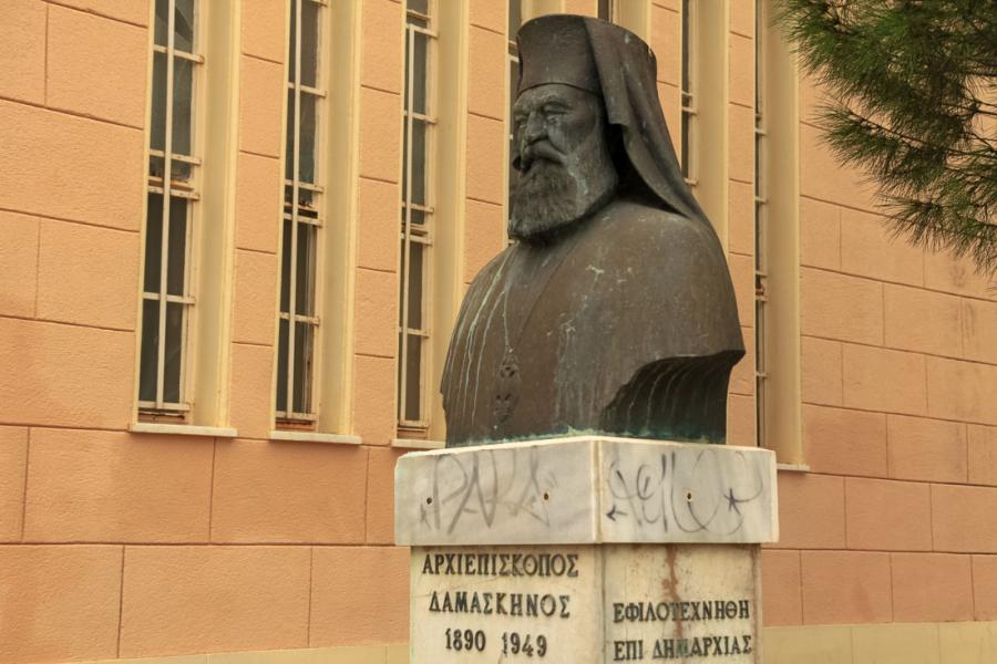 Archbishop Damaskinos' bust outside the church of Apostolos Pavlos. - by  