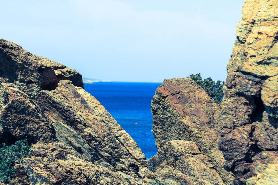 View through the rocks, above Vai beach in Sitia, Crete. - by adampao 