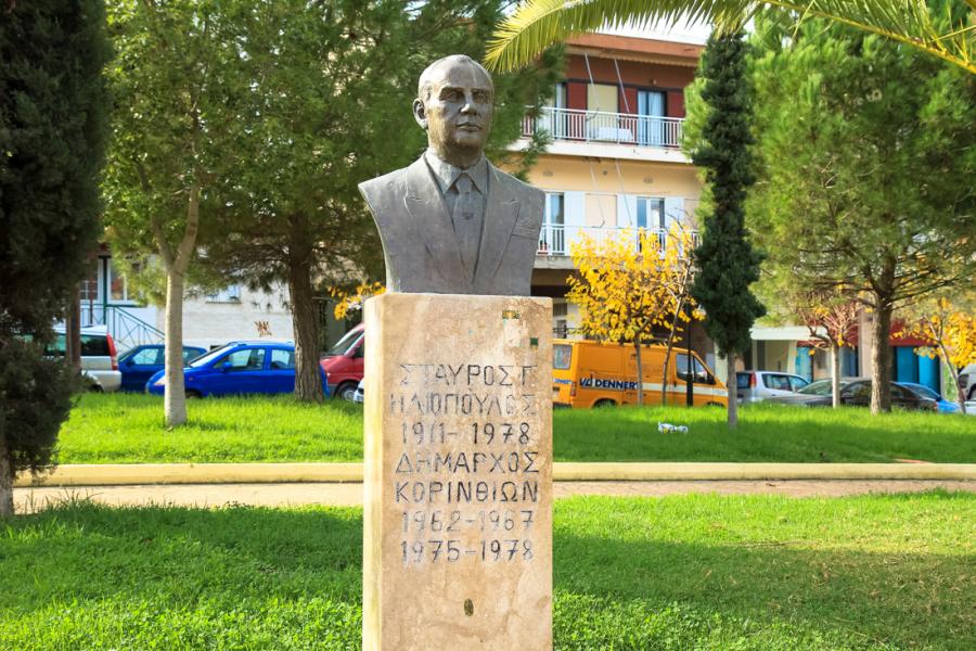 Bust of Iliopoulos in the homonymous square in Corinth. - by  