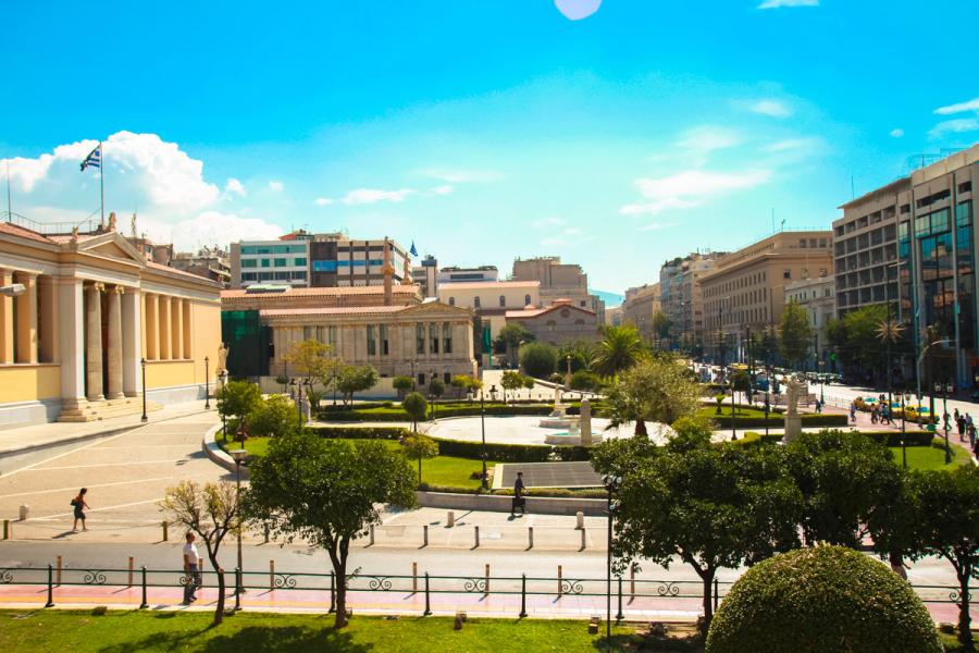 The area in front of the University of Athens, and the university can be seen on the left. - by adampao 