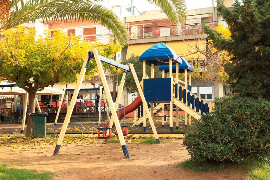 Playground in Iliopoulos' square, Corinth. - by  