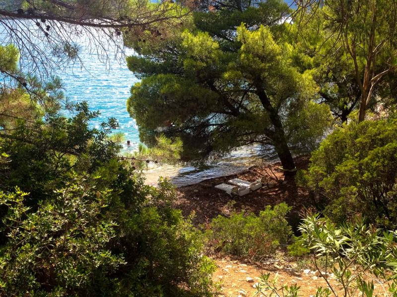 The small beach through the private path in Skinos bay.